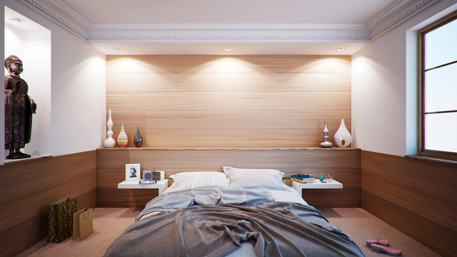 a bedroom with bed and furniture